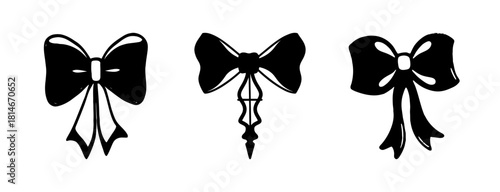 Three distinct black bow tie ribbon silhouettes vector art set.