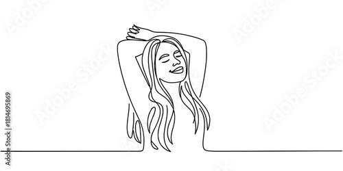a woman smiling with arms behind her head, expressing relaxation, comfort, positivity, and peaceful emotion.
