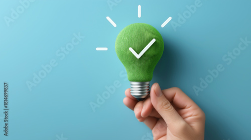 Green light bulb with checkmark for eco-friendly and smart ideas