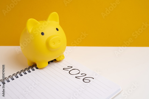 Happy New Year 2026 and piggy bank. Goals, plans, actions, savings, pension fund, investments. Financial concepts