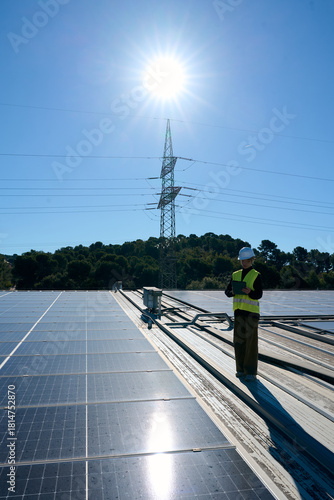 Engineer technician inspecting solar panels for renewable energy