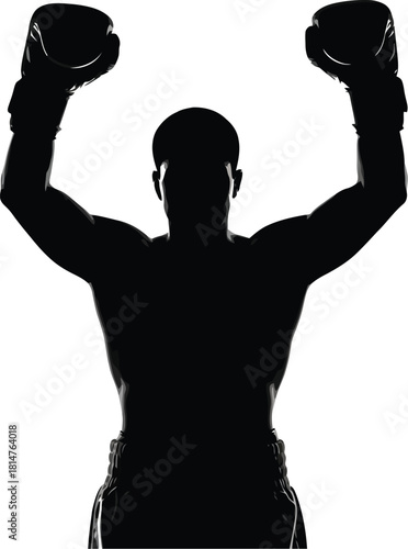 Silhouette of a triumphant male boxer raising his gloved hands in a gesture of victory and success