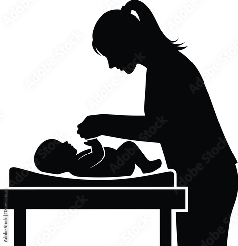 Silhouette of mother changing baby diaper on changing table