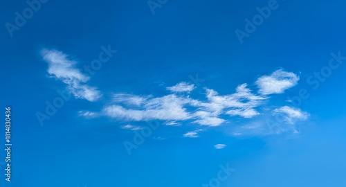 Structure of some cloud on the blue sky. White relaxed cottony form. Background serene sky. Fiber contours after rain. Lonely substance of water.