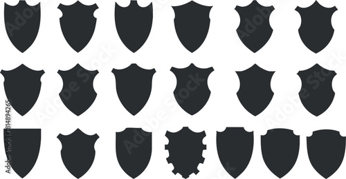 Collection of black silhouette shield icons in various styles for branding, design, and security concepts