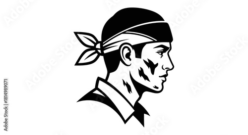 Profile of a determined person wearing a bandana looking forward.