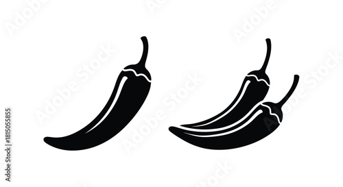 Two black silhouette chili peppers a simple graphic illustration