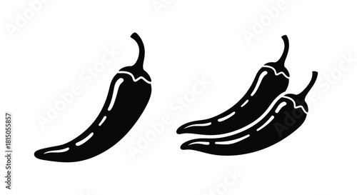 Two black silhouette chili peppers a simple graphic illustration