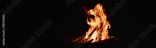 Anamorphic video: bonfire on black background