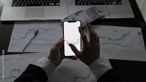 investment stockbroker stock market analysis price trend. Stock market trader analyzing bitcoin price trend. Investment broker trading bitcoin crypto currency using phone and laptop. Multiple devices