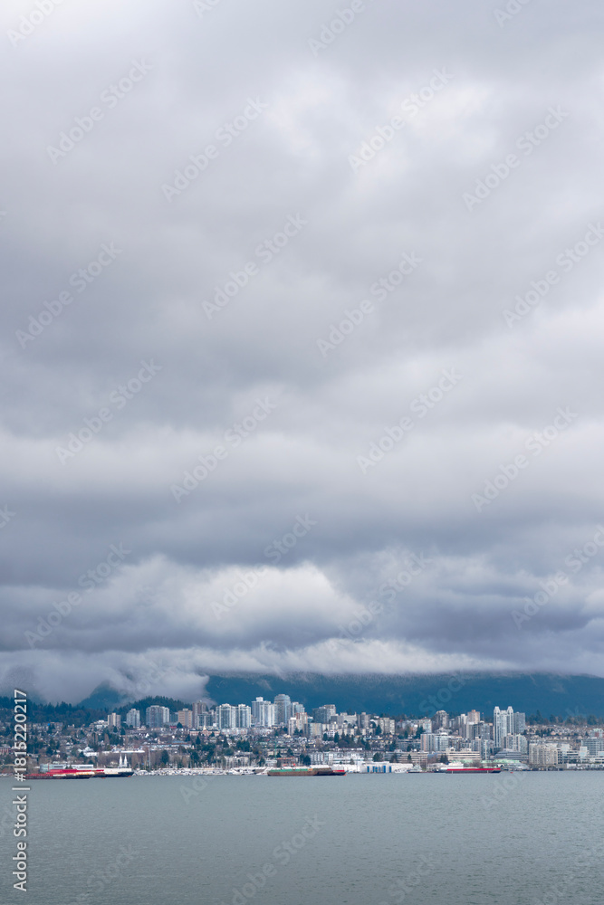 Fototapeta premium North Vancouver Clouds and Mountains.North Vancouver across Burrard Inlet. Coast Mountains and clouds in the background. 