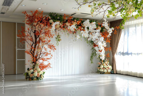 Elegant Floral Arch with Silk Curtains and Butterfly Accent