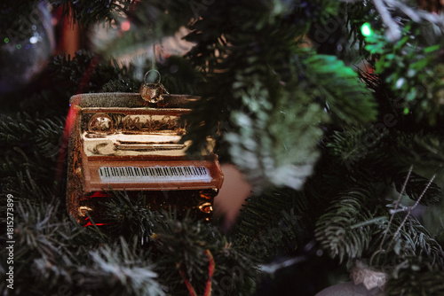 One beautiful Christmas tree decoration in the shape of a piano.