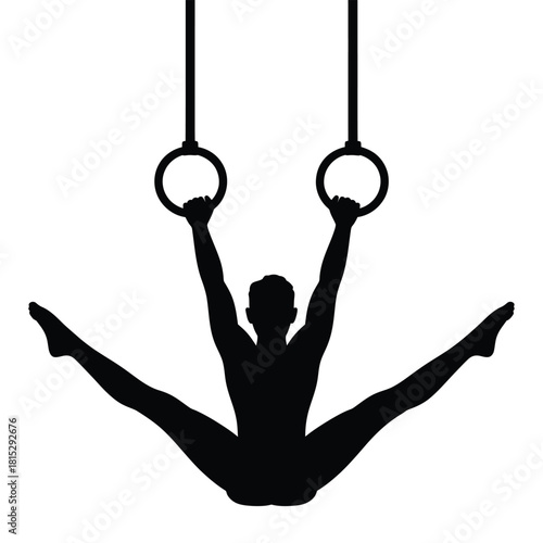 Gymnast silhouette performing a split on gymnastic rings