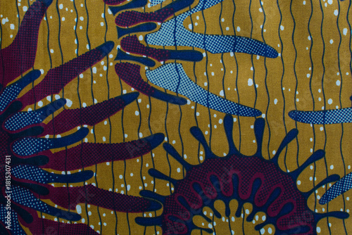 top view of brown ankara fabric, flatlay of nigerian wax cloth with designs, spread out brown ankara material