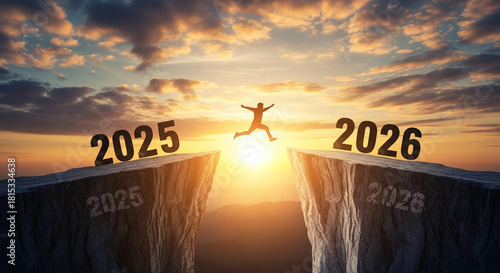Silhouette of person jumping across a chasm between two cliffs marked with the years 2025 and 2026 during a dramatic sunset symbolizing transition and new beginning