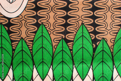 top view of green ankara fabric, flatlay of nigerian wax cloth with designs, spread out green ankara material