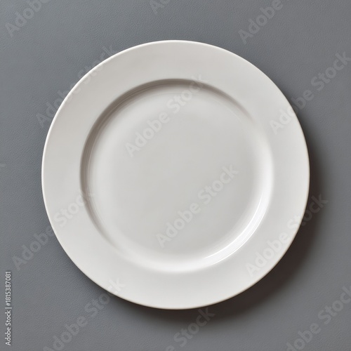 Minimalist Tableware: A pristine, empty plate, designed with clean lines and a simple aesthetic, sits centrally against a flat, subtle backdrop. This image embodies elegance and refined simplicity.