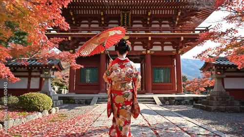 Woman in Kimono with Umbrella at Japanese Temple During Autumn.
