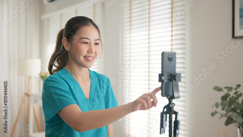 Young adult woman asia Gen Z people anti aging expert modern nurse live talk prepare video selfie camera on mobile phone app mental health care Online side hustle digital virtual asian vlogger filming