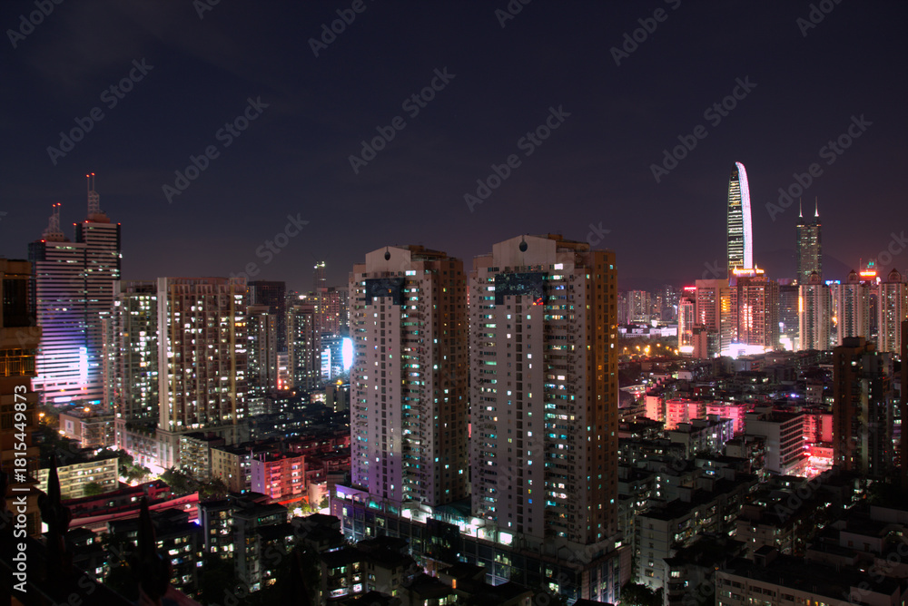 Fototapeta premium new york city at night Displays a cityscape at night with numerous lit buildings. Full-frame composition, multicolor tone. Realistic style, urban background