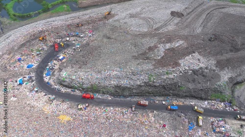 Wallpaper Mural  Aerial footage of a landfill in Medan, showcasing heavy machinery managing and organizing waste efficiently Torontodigital.ca