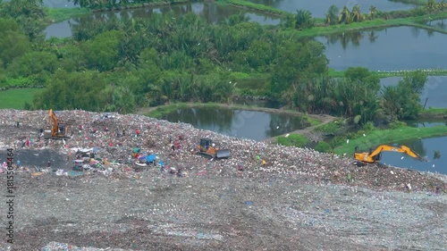 Aerial footage of a landfill in Medan, showcasing heavy machinery managing and organizing waste efficiently