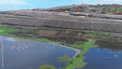  Aerial footage of a landfill in Medan, showcasing heavy machinery managing and organizing waste efficiently