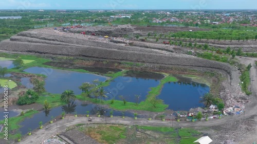  Aerial footage of a landfill in Medan, showcasing heavy machinery managing and organizing waste efficiently