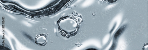 Mesmerizing abstract background showing shiny liquid metal surface. This bubbling chrome and silver texture creates calm and fluid visual with metallic finish