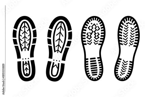Four distinct black and white boot sole prints arranged in a row