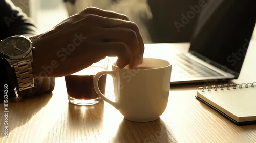 Wallpaper Mural Mug Tapping, Coffee, and Hand at a Table for Remote Work, Online Business, or Break in a House, Symbolizing Routine and Focus. Torontodigital.ca