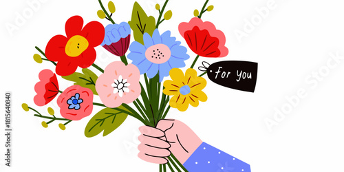Hand holding a colorful flower bouquet with a for you tag