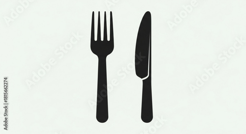 Classic black silhouette of a fork and knife, essential dining utensils for a meal, symbolizing food, restaurant, and kitchen concepts