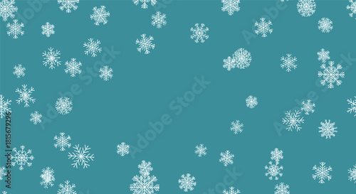 Simple and elegant winter background with various white snowflakes of different sizes falling against a solid dusty teal blue backdrop.