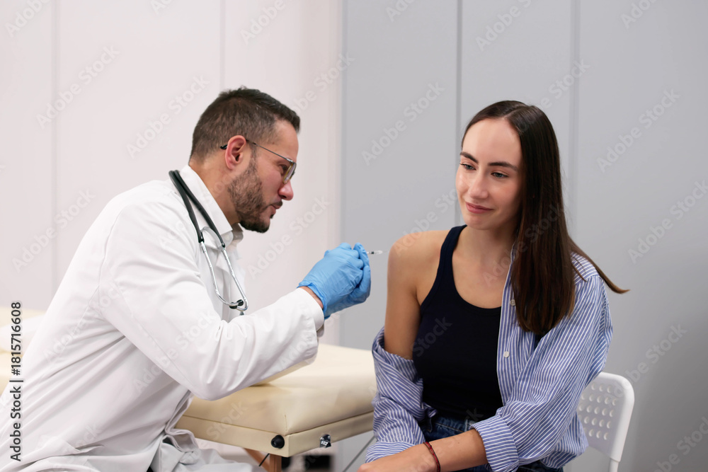 Fototapeta premium Female Doctor Injecting Diabetes Vaccine Into Man's Arm
