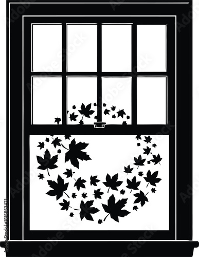 Autumn leaf wreath decoration on a window pane