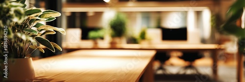 Modern Workspace Interior with Wooden Table and Green Plants. blurred background