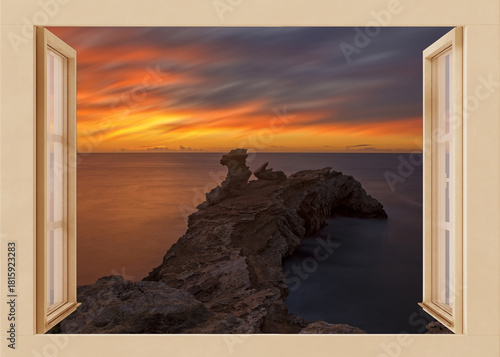 Open window to a seascape at dawn
