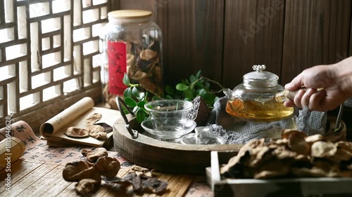 Traditional Chinese Tea Ceremony with Glass Teapot and Chenpi on Wooden Table