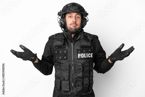 SWAT caucasian man isolated on white background having doubts while raising hands