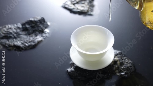 White tea cup on stone surface with natural mineral rocks in serene minimalist setting