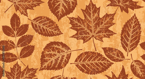 A rustic seamless pattern of various autumn leaves in monochrome brown with a grunge texture effect perfect for fall backgrounds.
