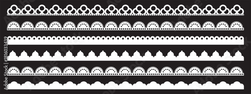 White perforated trim collection with semicircular borders and delicate punched holes. Elegant decorative strips featuring repeated wave patterns, ideal for vintage framing and craft applications.