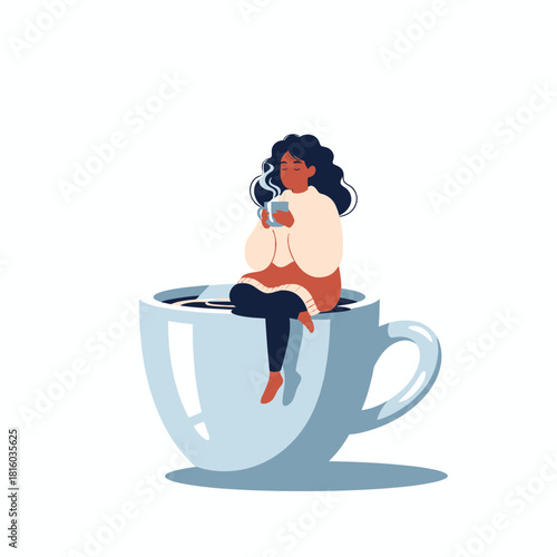 A woman enjoys a peaceful moment on a giant mug, relaxing with a warm drink