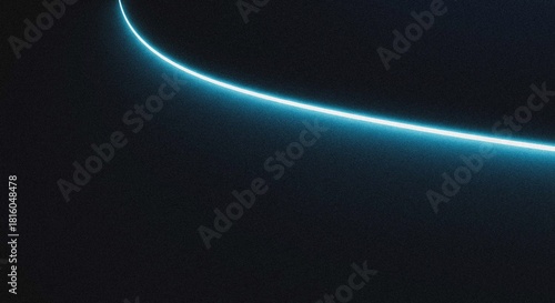 Striking abstract light trail featuring a vibrant cyan glow and a subtle grainy gradient, gracefully arcing across a vast, deep dark background