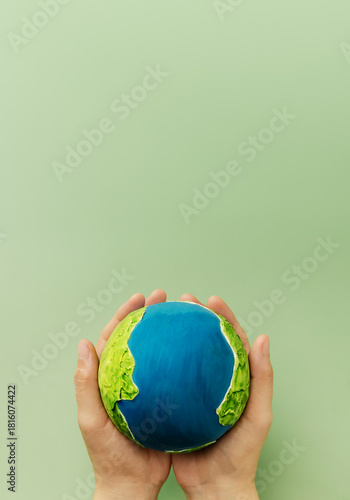 Earth in hands symbolizing sustainability, global environmental care