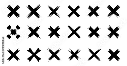 Collection of diverse hand drawn grunge cross marks and brushstroke signs with dirty textures ideal for design elements