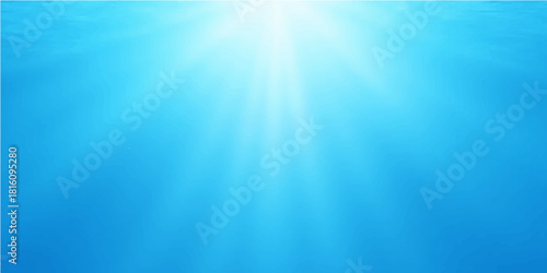 Bright underwater scene with sun rays beaming through the blue ocean water, creating a vibrant sea background with a light burst
