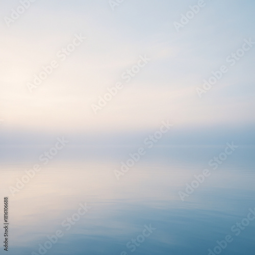 Soft morning light over a calm lake with gentle reflections